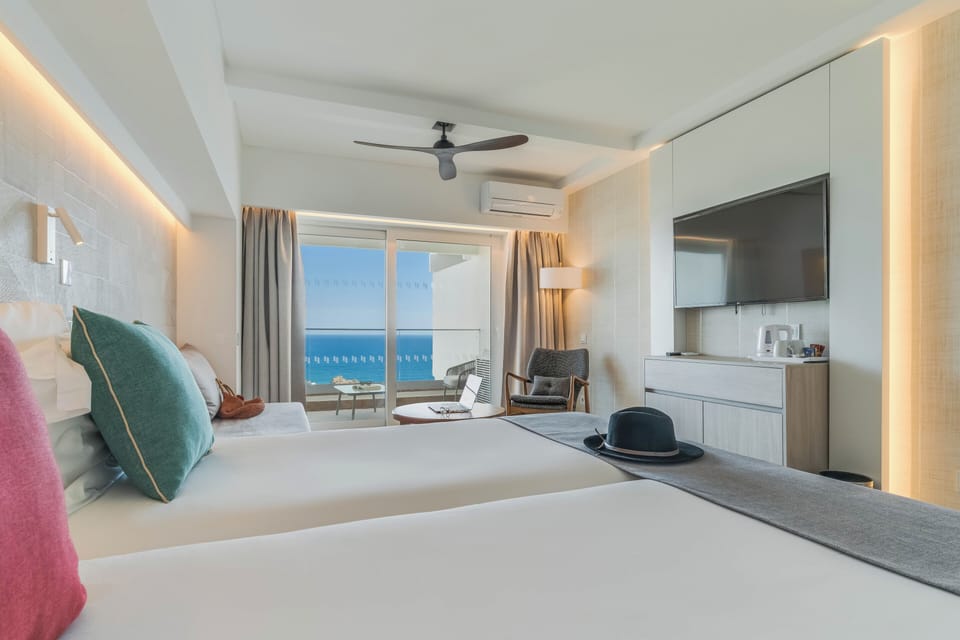Double or Twin Room, Sea View | Minibar, in-room safe, blackout drapes, free cribs/infant beds