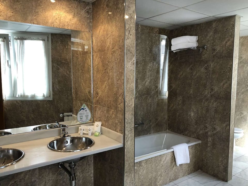 Bathtub, hair dryer, towels