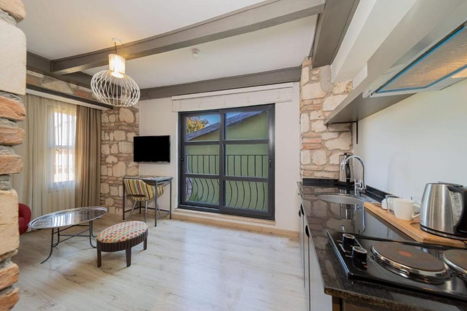 Deluxe Double Room, 1 Bedroom | Living area | TV