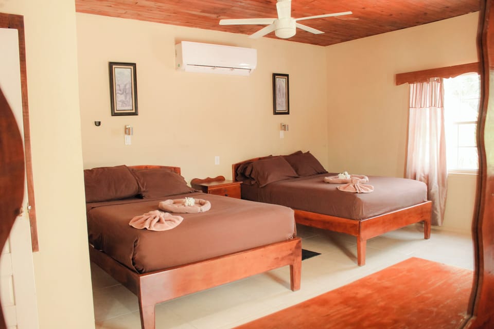 Comfort Suite, 2 Double Beds, Partial Sea View | Blackout drapes, iron/ironing board, free WiFi, bed sheets