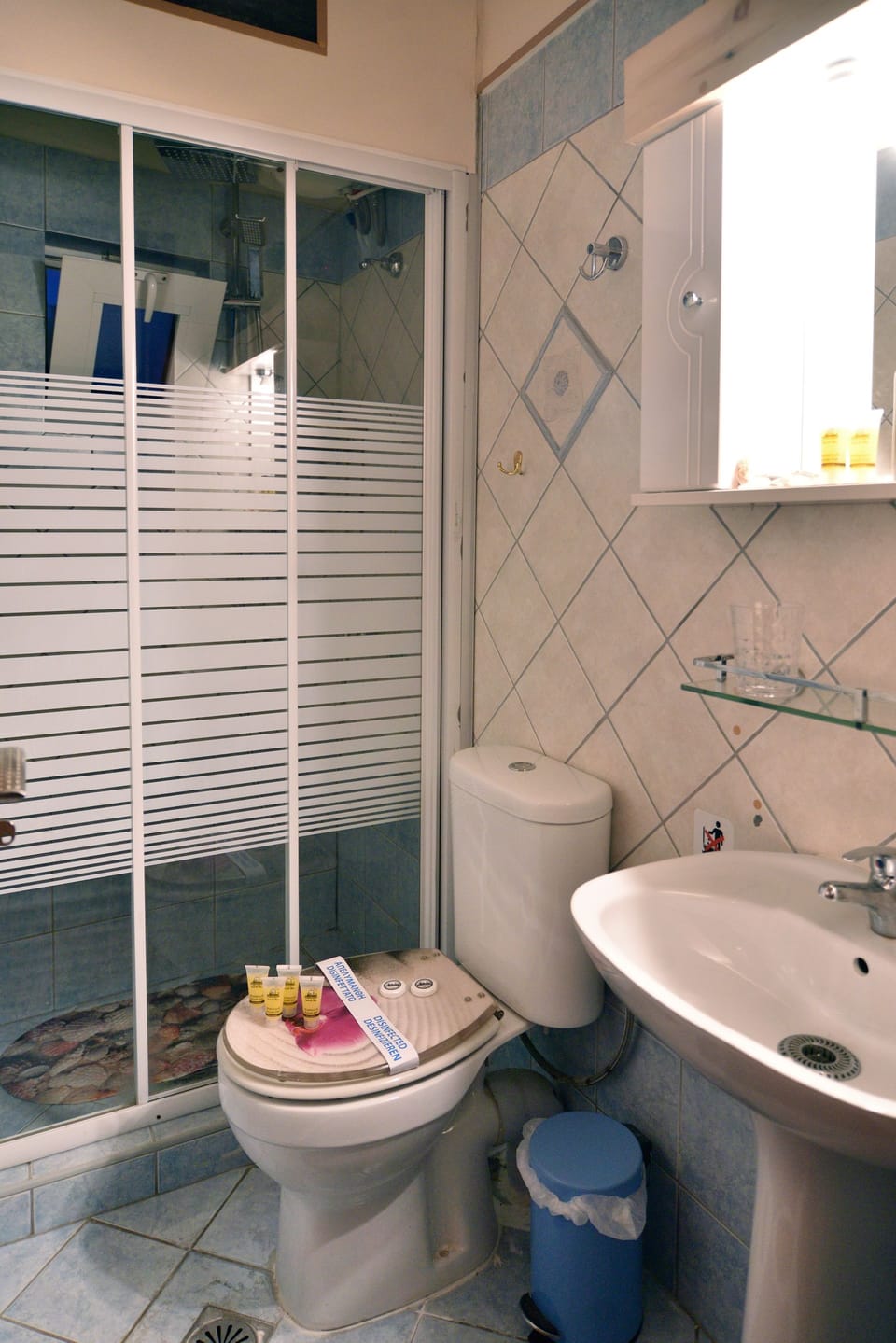 Shower, rainfall showerhead, hair dryer, towels