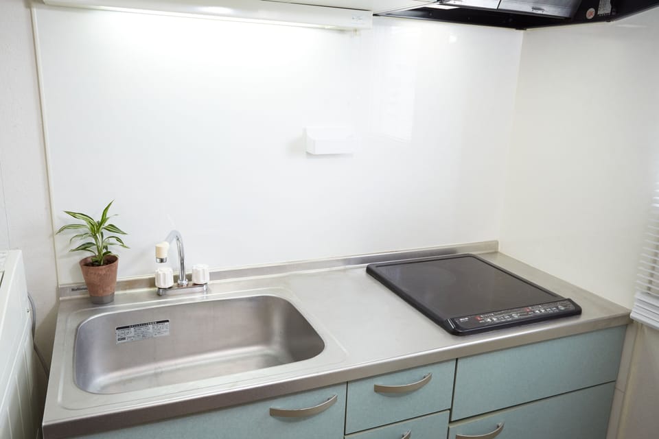 Fridge, microwave, electric kettle, cookware/dishes/utensils