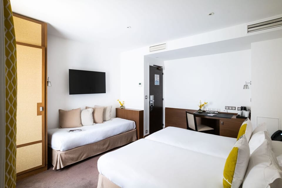 Triple Room | Free minibar items, in-room safe, desk, soundproofing