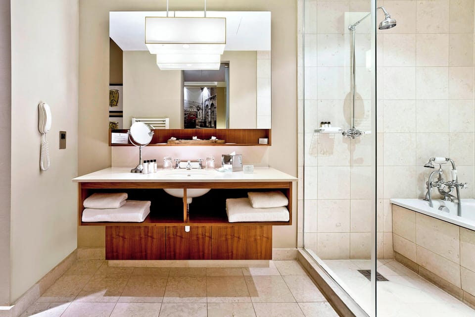 Combined shower/tub, designer toiletries, hair dryer, bathrobes