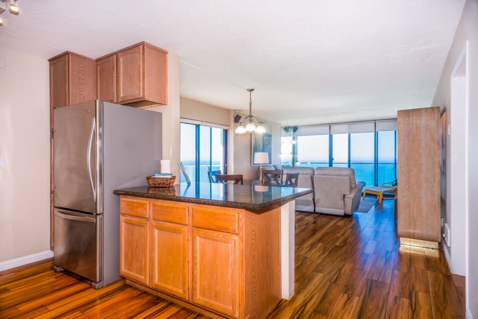 2 Bedroom Condominium - 601 | Private kitchen | Full-size fridge, microwave, stovetop, dishwasher