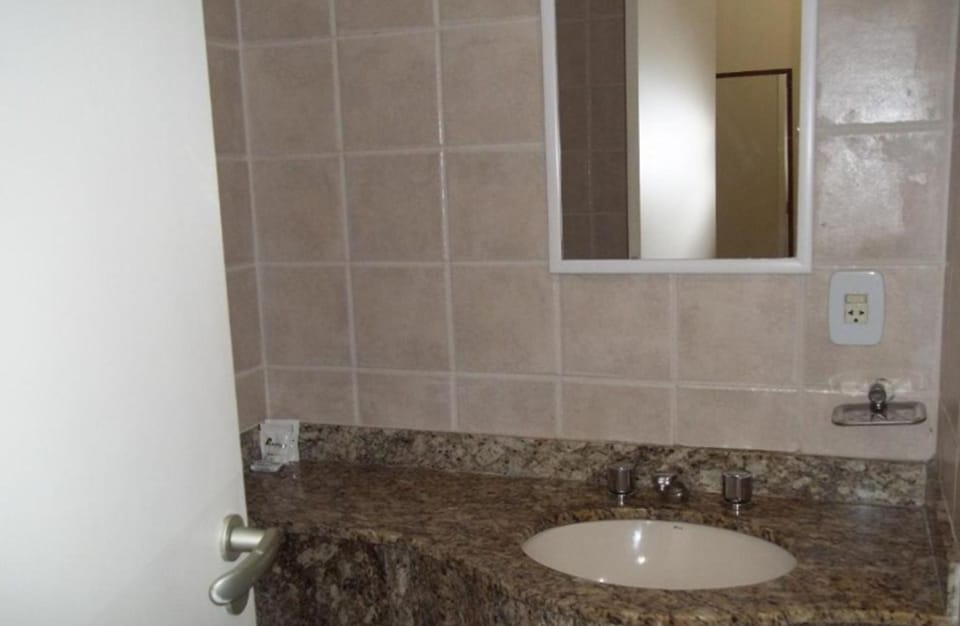 Economy Room | Bathroom | Shower, hair dryer, bathrobes, towels