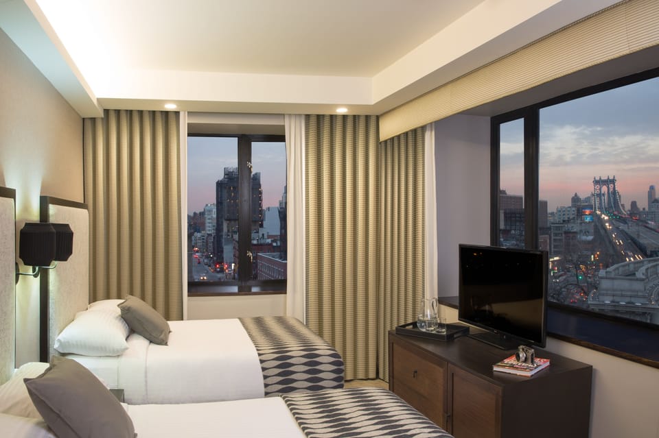 Deluxe Corner Doubles | Premium bedding, in-room safe, desk, soundproofing