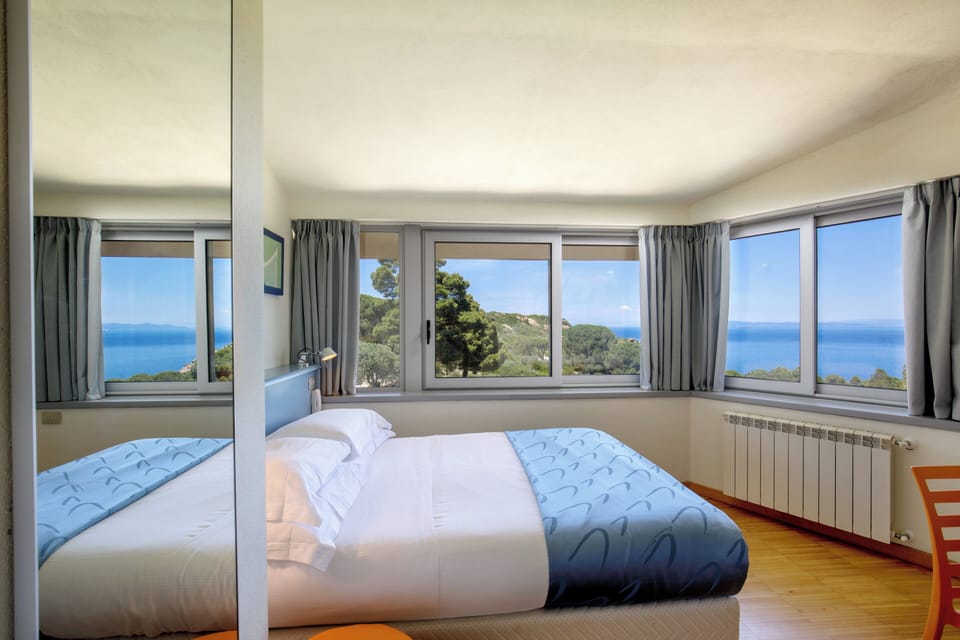 Economy Double Room, Sea View | Premium bedding, minibar, in-room safe, desk