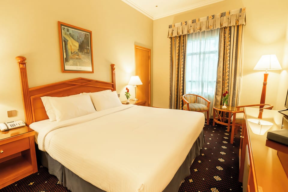 Deluxe Room | Down comforters, minibar, in-room safe, individually decorated