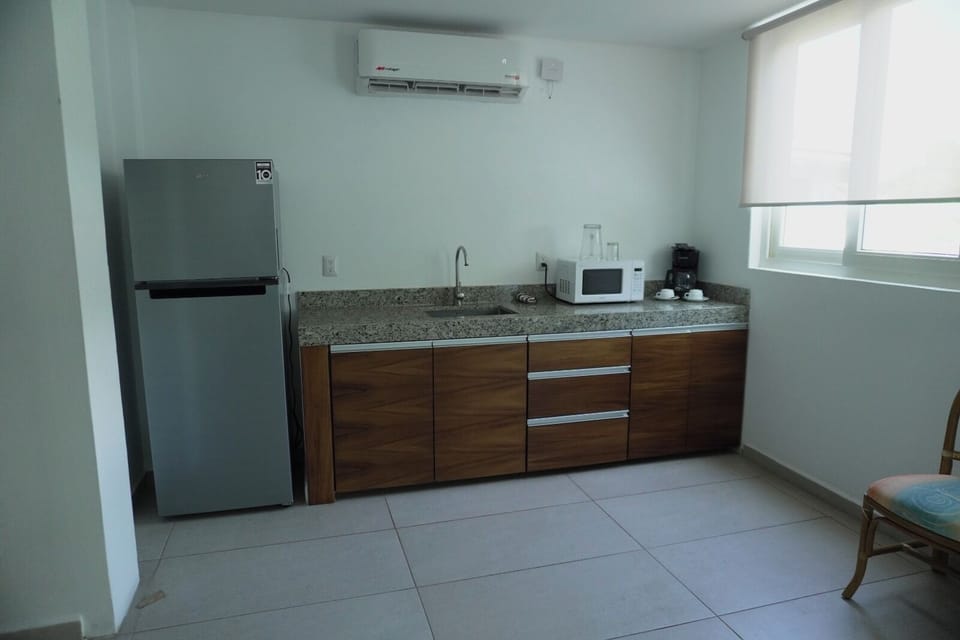 Studio, Garden View | Private kitchen | Fridge, microwave, coffee/tea maker, cookware/dishes/utensils