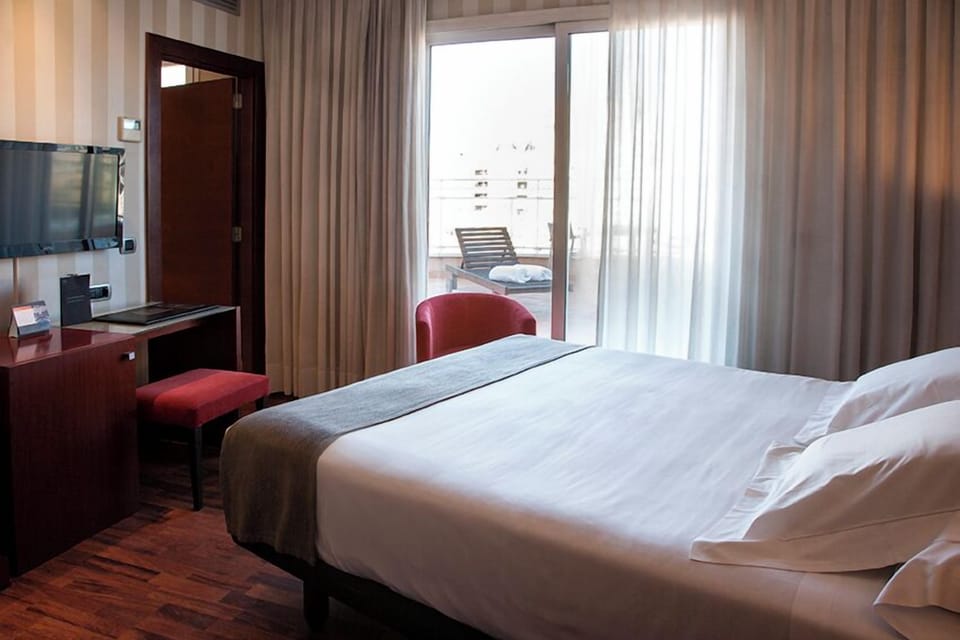 Superior Double Room, Balcony | Minibar, in-room safe, desk, laptop workspace