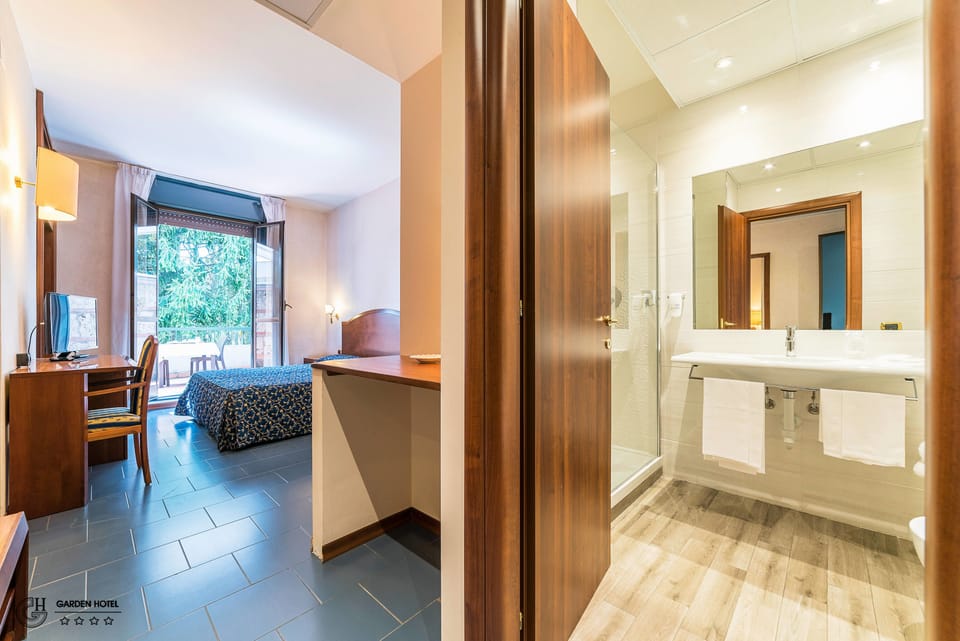 Single Room | Down comforters, minibar, in-room safe, desk