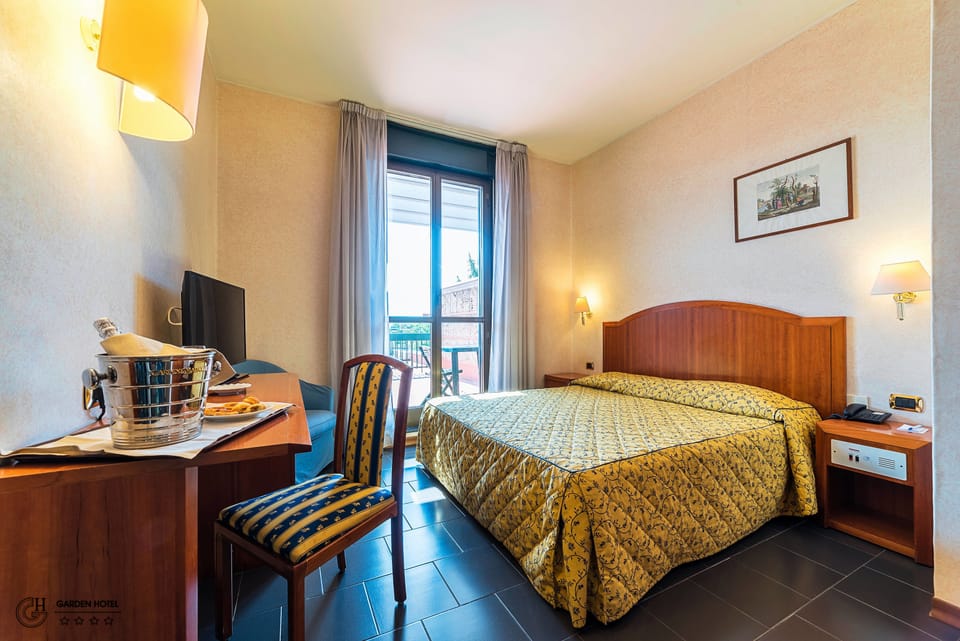 Quadruple Room | Down comforters, minibar, in-room safe, desk