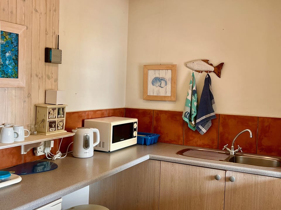 Family Room | Private kitchen | Electric kettle, highchair