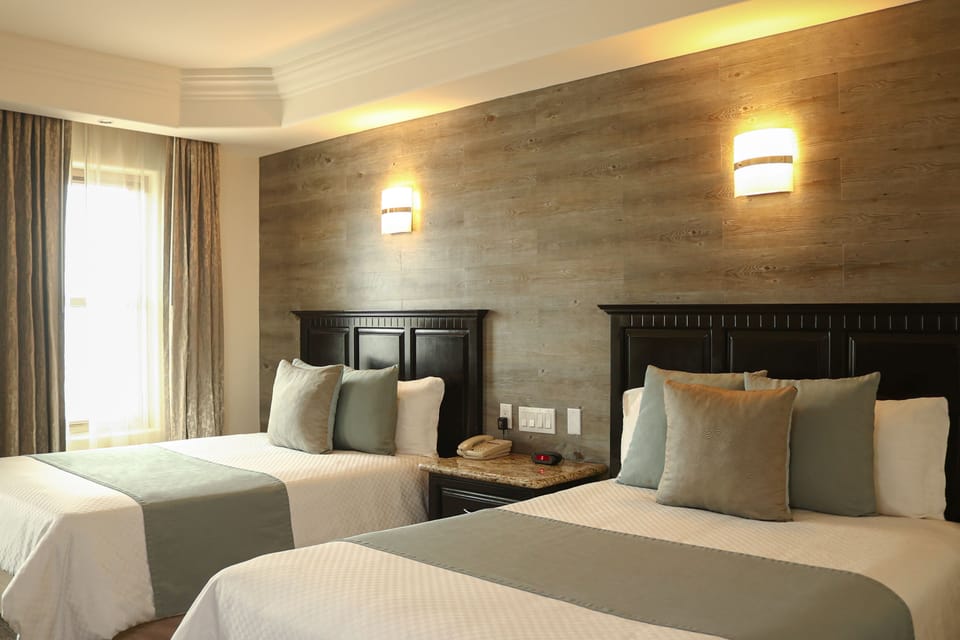 Double Room | Minibar, in-room safe, desk, iron/ironing board