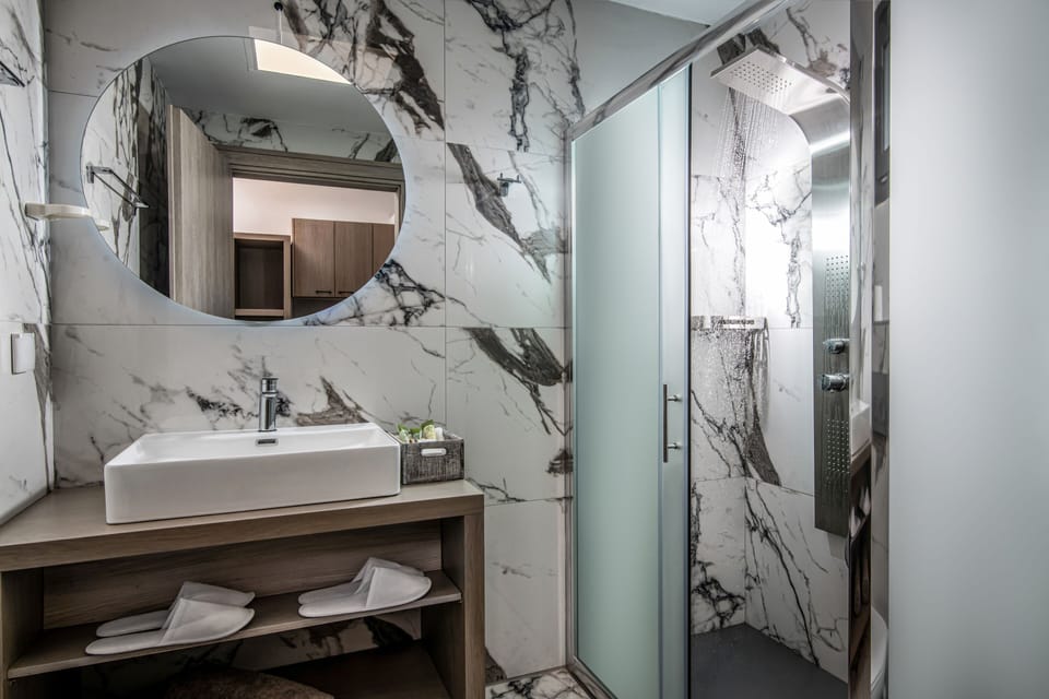 Shower, free toiletries, hair dryer, slippers