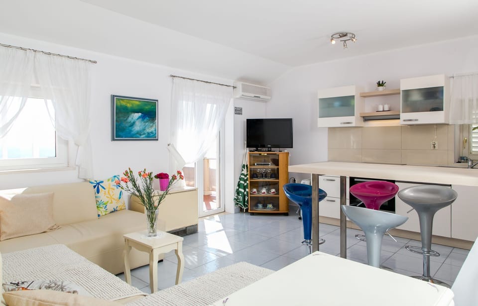 Apartment, 1 Bedroom, Balcony, Sea View | Living area | 80-cm LCD TV with satellite channels, TV