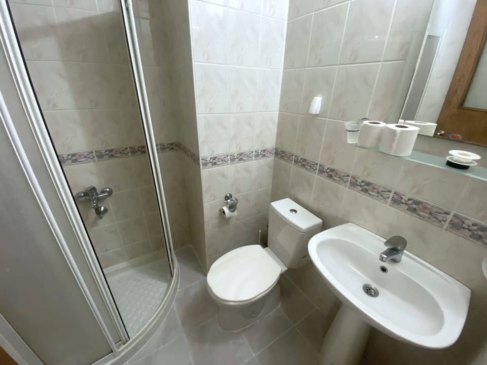 Shower, free toiletries, hair dryer, slippers