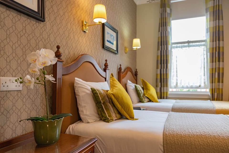 Quadruple Room | In-room safe, desk, laptop workspace, blackout drapes