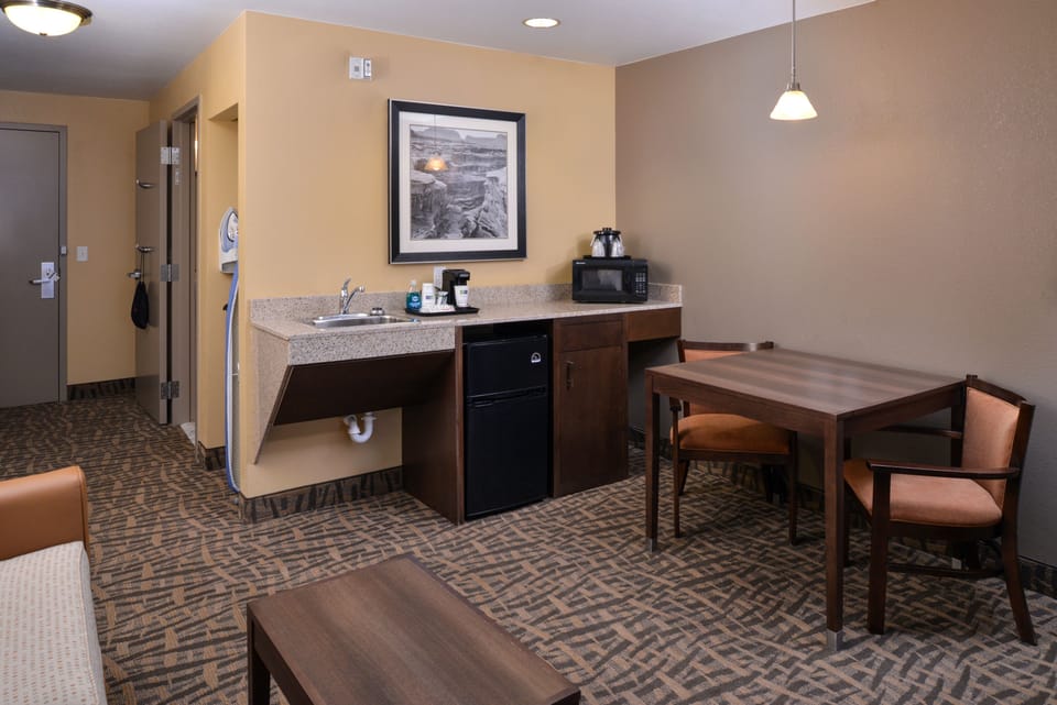 Suite, 1 King Bed, Roll-in Shower (Roll-In Shower) | Desk, blackout drapes, iron/ironing board, cribs/infant beds