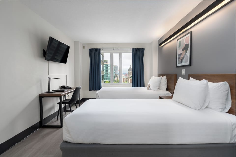 Room, 2 Twin Beds, Non Smoking, Shared Bathroom (Hallway Bathroom) | In-room safe, desk, laptop workspace, iron/ironing board