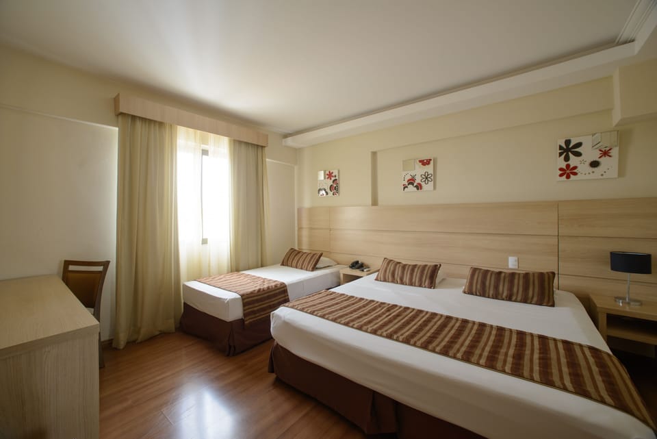 Family Room | Minibar, in-room safe, laptop workspace, blackout drapes