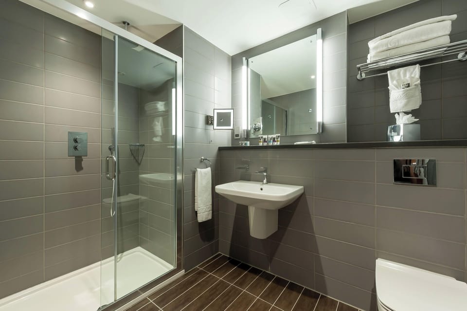 Shower, eco-friendly toiletries, hair dryer, towels