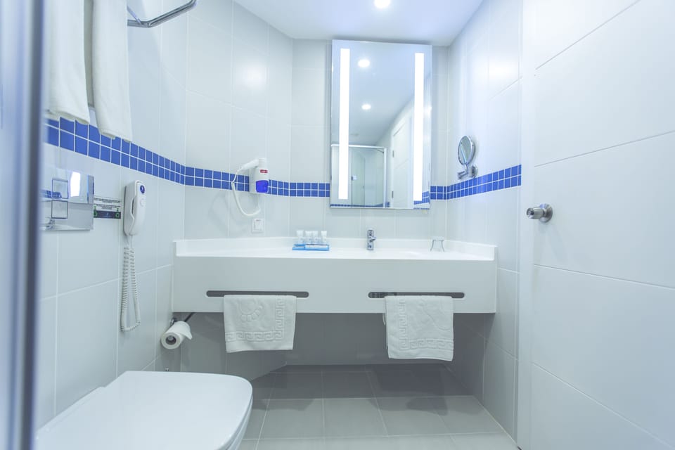 Shower, free toiletries, hair dryer, slippers