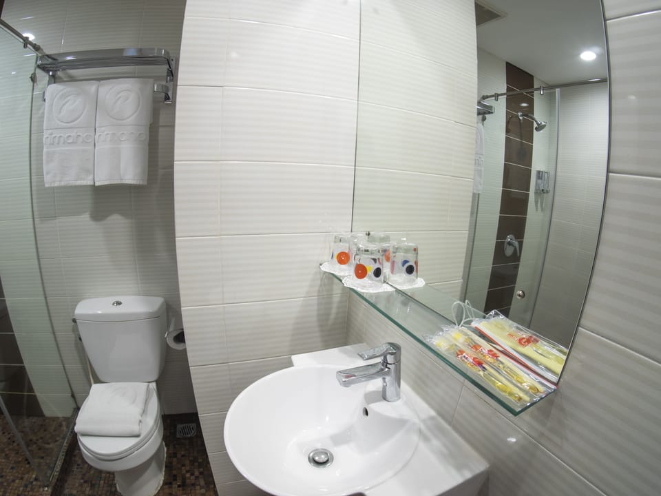 Shower, hair dryer, slippers, towels