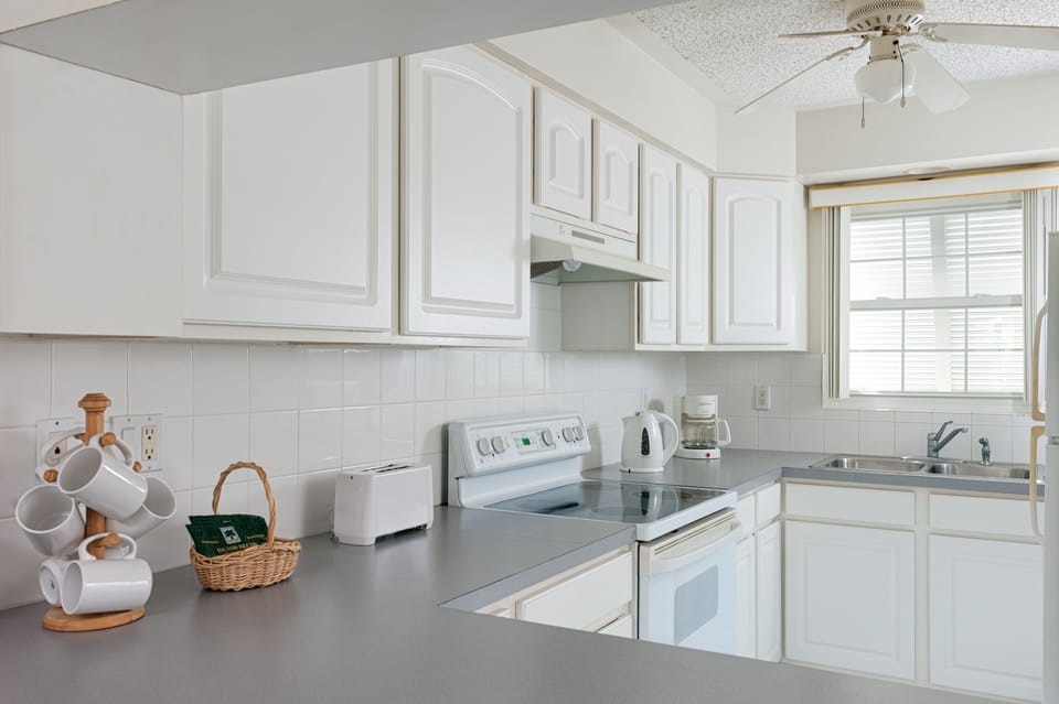 Townhome, 2 Bedrooms, Poolside | Private kitchen | Coffee/tea maker, full-size fridge, microwave, oven