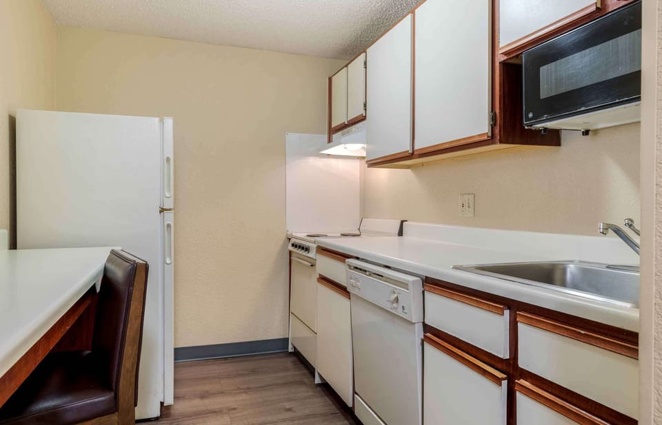 Deluxe Studio, Multiple Beds, Non Smoking | Private kitchen | Full-size fridge, microwave, stovetop