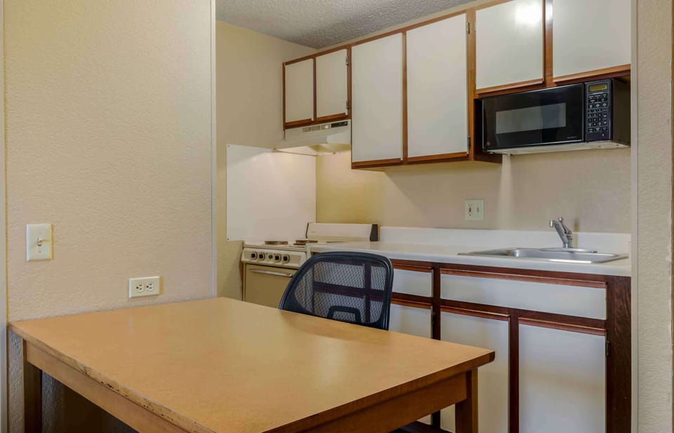Studio, 1 Queen Bed, Non Smoking | Private kitchen | Full-size fridge, microwave, stovetop
