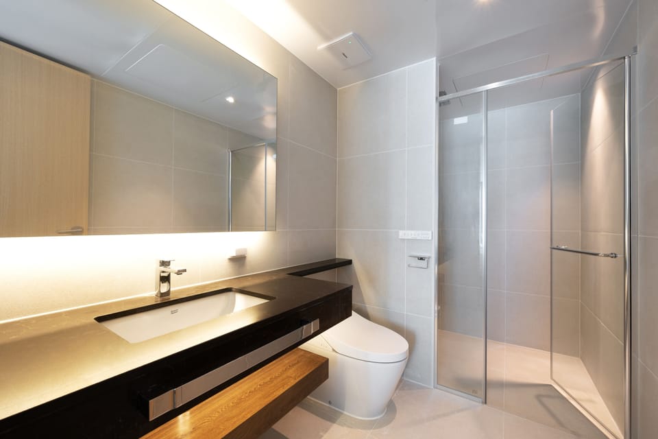 Ocean Suite Family | Bathroom | Shower, rainfall showerhead, hair dryer, slippers