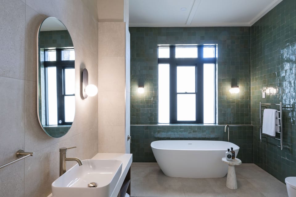 Separate tub and shower, rainfall showerhead, designer toiletries