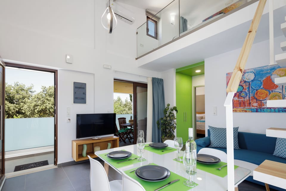 Apartment, 2 Bedrooms, Pool View | Living room | 43-inch Smart TV with cable channels, TV