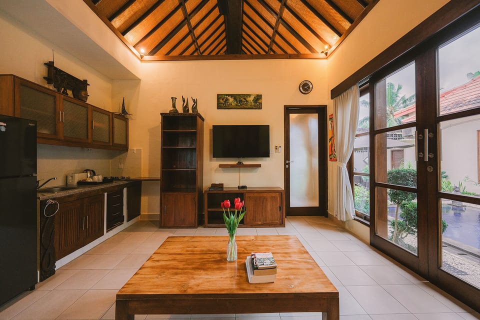 1 Bedroom Suite Villa | Living area | 32-inch flat-screen TV with cable channels, TV