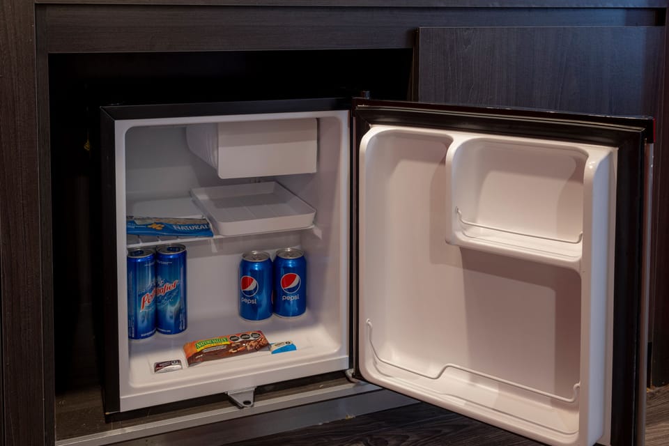 Junior Suite, 1 King Bed | In-room safe, desk, iron/ironing board, free WiFi