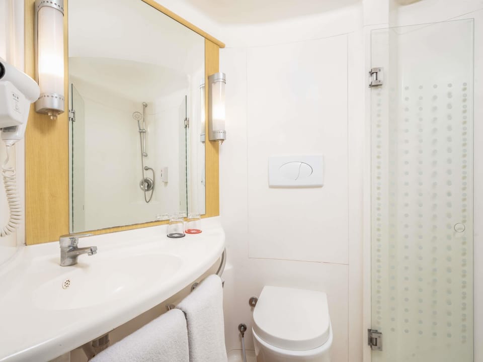 Shower, eco-friendly toiletries, hair dryer, slippers