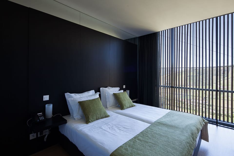 Double or Twin Room | Minibar, in-room safe, desk, blackout drapes