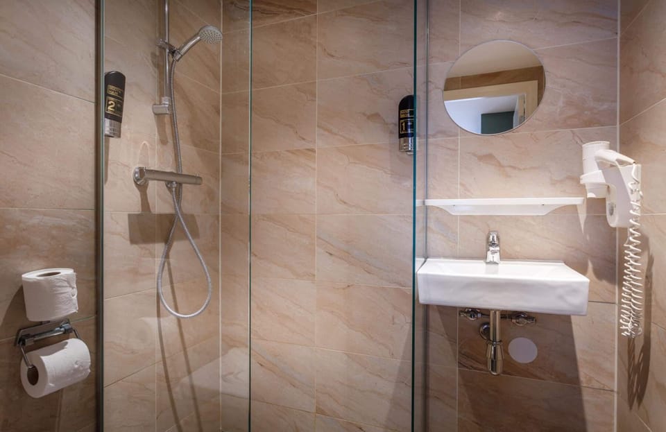 Shower, free toiletries, hair dryer, towels