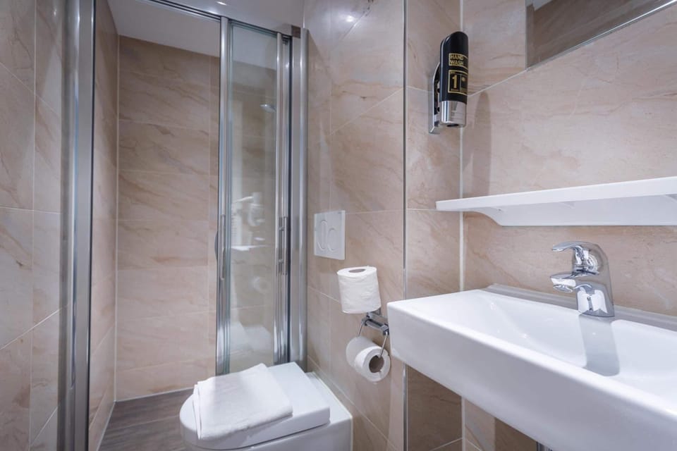 Shower, free toiletries, hair dryer, towels
