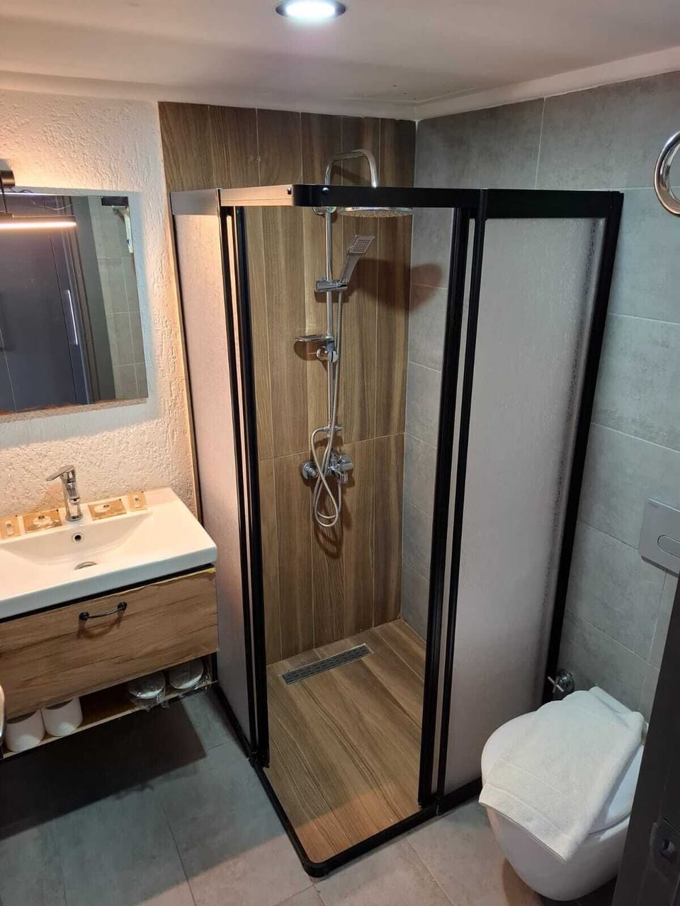 Shower, rainfall showerhead, designer toiletries, hair dryer