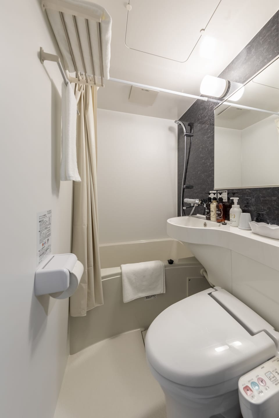 Combined shower/tub, free toiletries, hair dryer, slippers