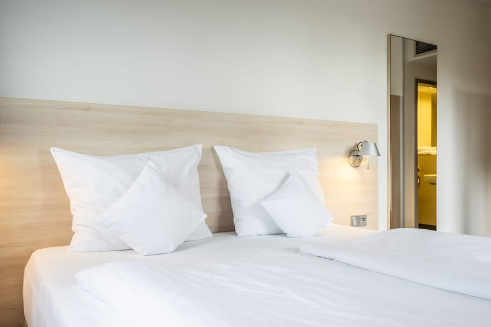 Premium bedding, pillowtop beds, desk, blackout drapes