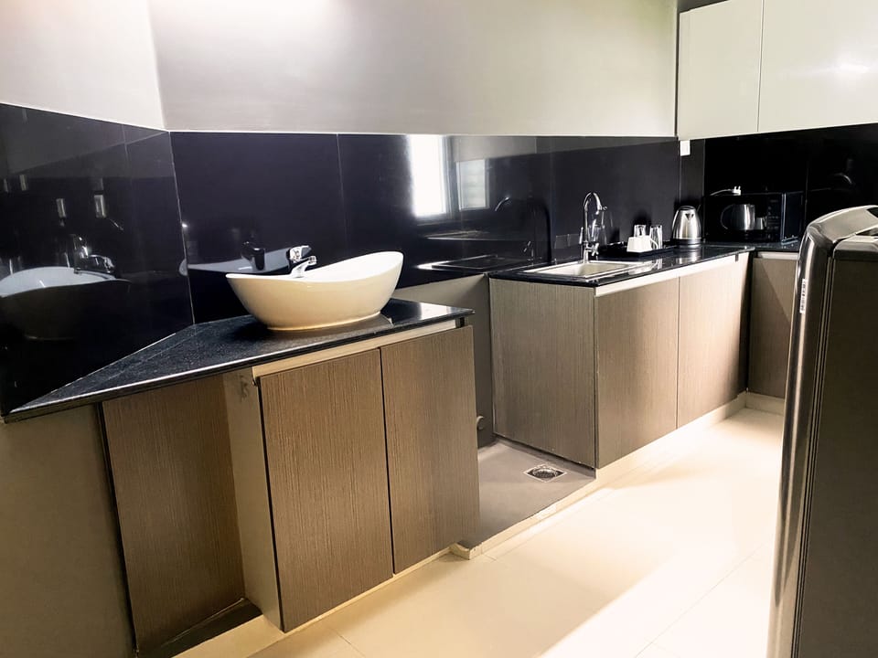 Fridge, microwave, electric kettle, cookware/dishes/utensils