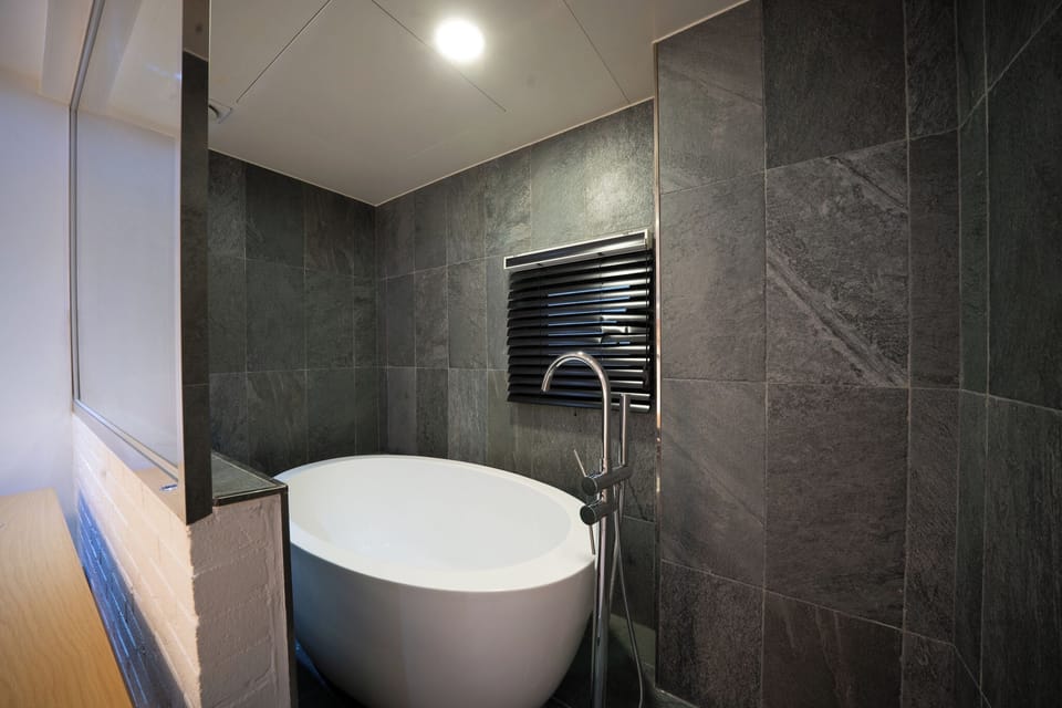 Premium Twin Room, 2 Bedrooms | Bathroom | Combined shower/tub, deep soaking tub, free toiletries, hair dryer
