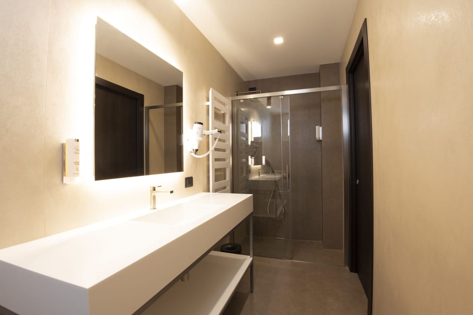 Shower, rainfall showerhead, eco-friendly toiletries, hair dryer