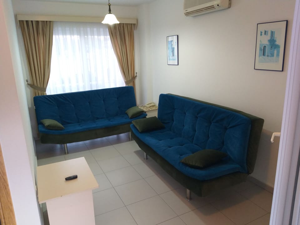 Apartment, 1 Bedroom, Pool View | Living area | 42-inch LCD TV with satellite channels, TV