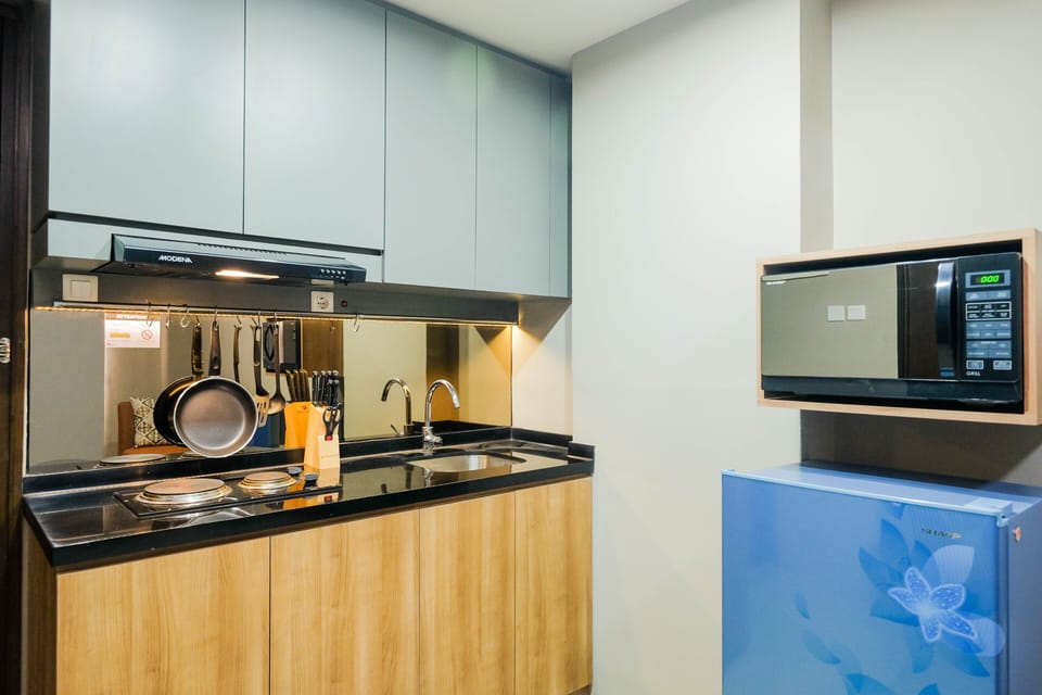 Condo, 2 Bedrooms | Private kitchen | Fridge, microwave, stovetop, cookware/dishes/utensils