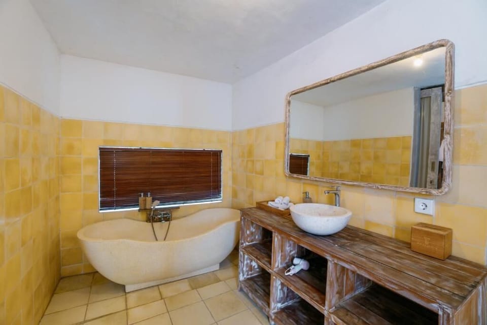 Villa, 1 Bedroom, Private Pool | Bathroom | Combined shower/tub, rainfall showerhead, free toiletries, slippers